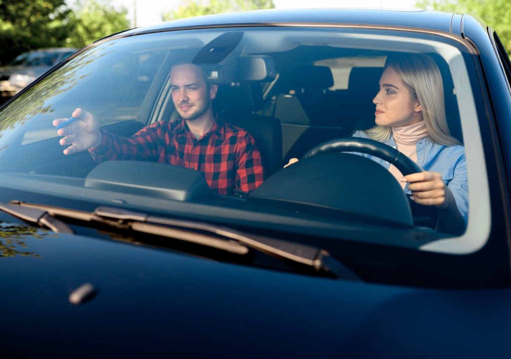 lady-and-male-instructor-in-car-driving-school.jpg